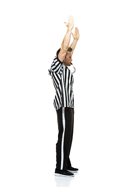 istock Football referee whistling & showing touch down 524325461