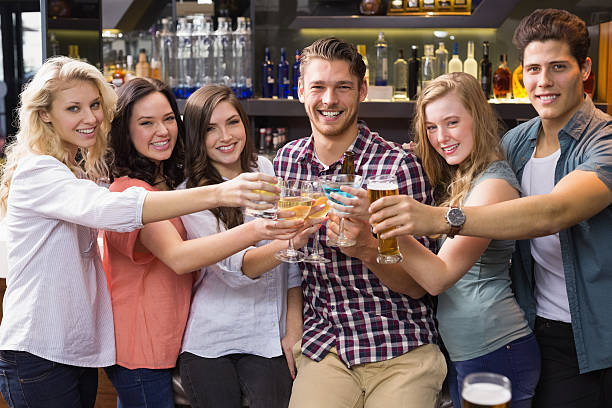 istock Young friends having a drink together 524327013