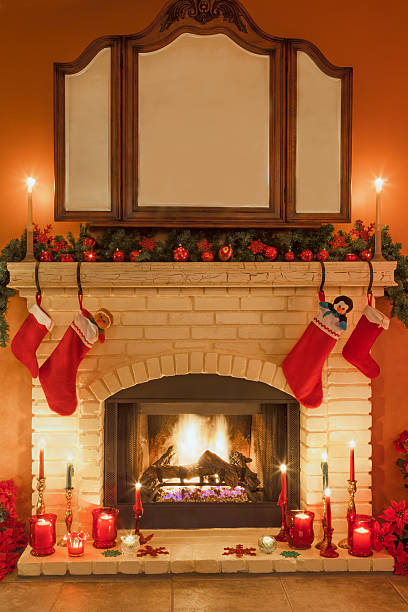 istock Christmas brick fireplace with stockings and candles (P) 524327493