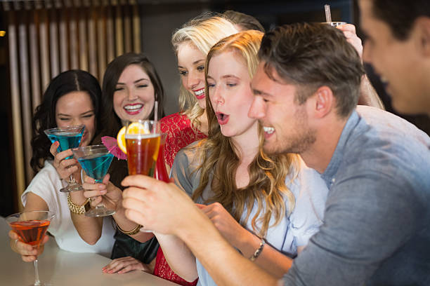 istock Young friends having a drink together 524328255