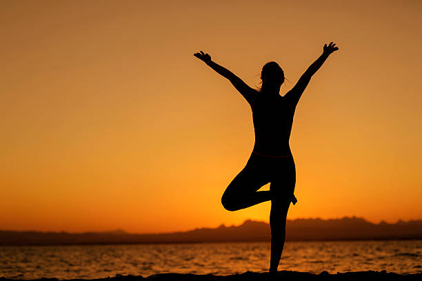 here's joyful life woman living healthy lifestyle on beach, pray. yoga stock pictures, royalty-free photos & images