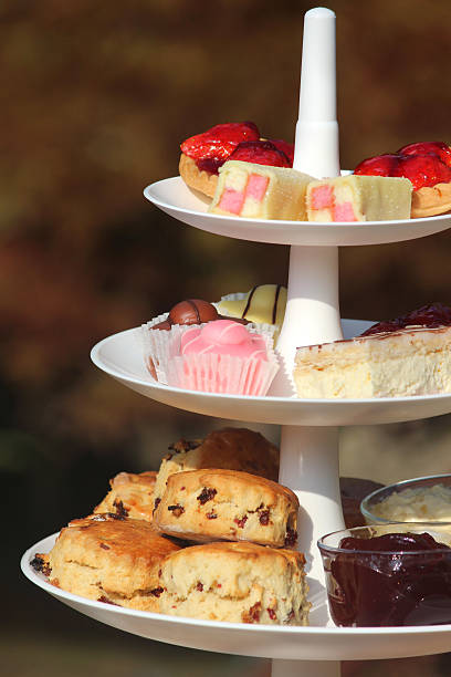 istock Afternoon tea / cream tea, tiered cake-stand, cakes, scones, jam, clotted-cream 524366687