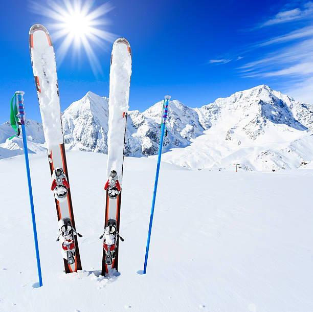istock Mountains and ski equipments on slope 524366791