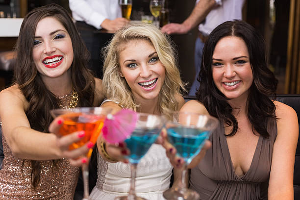istock Happy friends drinking cocktails together 524368213