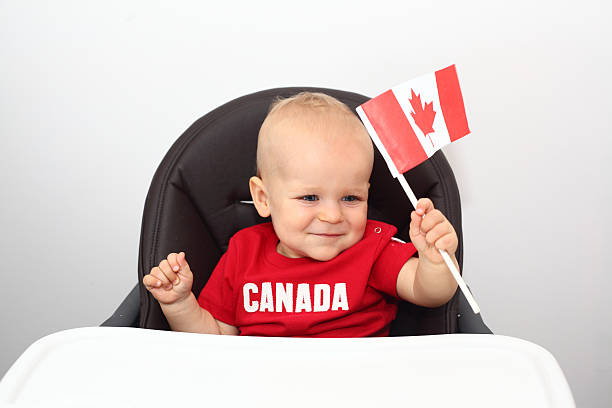 Smiling baby boy with the Canadian flag