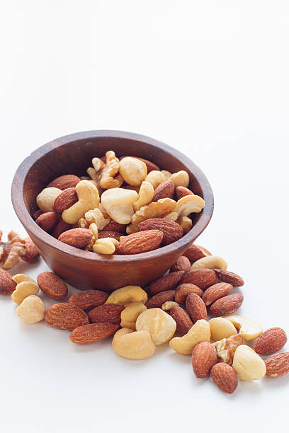 istock mixed nuts in a bowl isolated on the white background 524369151