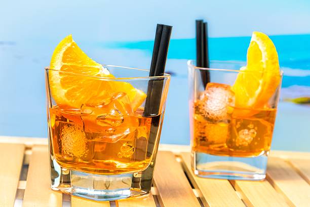 istock aperitif  cocktail with orange slices and ice cubes 524369370