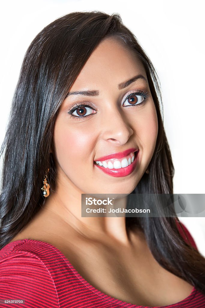 Portrait of a beautiful hispanic woman with long black hair Close up of a beautiful hispanic woman 20-30 years old.  She has long black hair and big brown eyes. She is looking at he camera with a gorgeous toothy smile.  Shot with a Canon 5D Mark 3 camera.  rm 20-29 Years Stock Photo