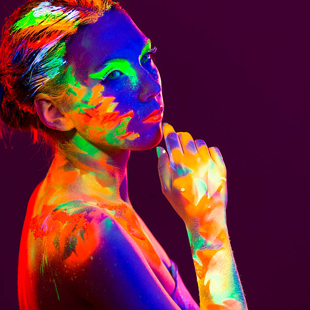 istock Woman Portrait painted with UV makeup color 524374351