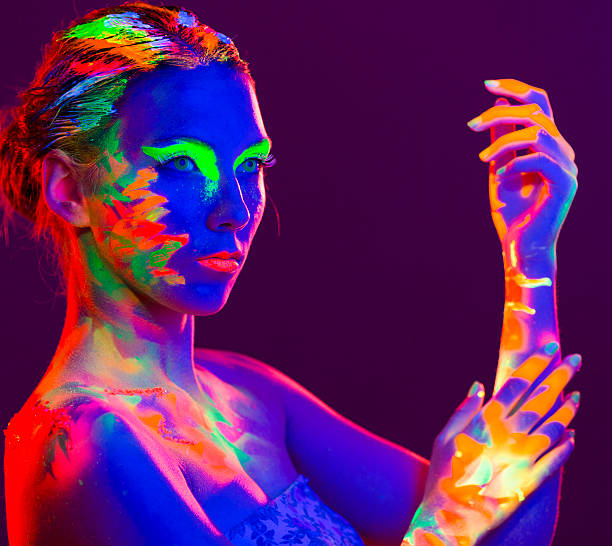 istock Woman Portrait painted with UV makeup color 524374357