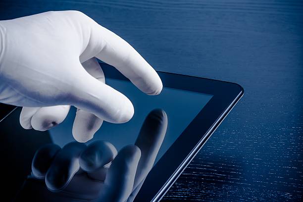 istock hand in medical glove touching modern digital tablet pc 524377112