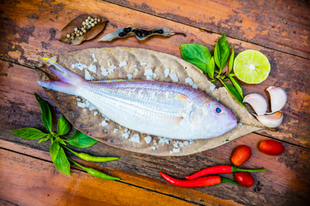 istock Delicious fresh fish on dark vintage background. 524378986