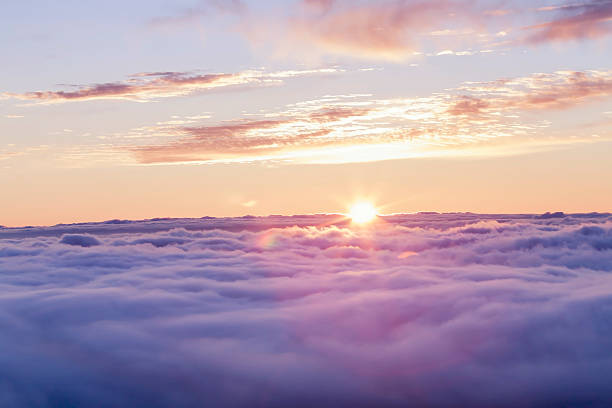 Divine sunset above the clouds Sunset above a soft cloudscape in Tenerife. sun above clouds stock pictures, royalty-free photos & images