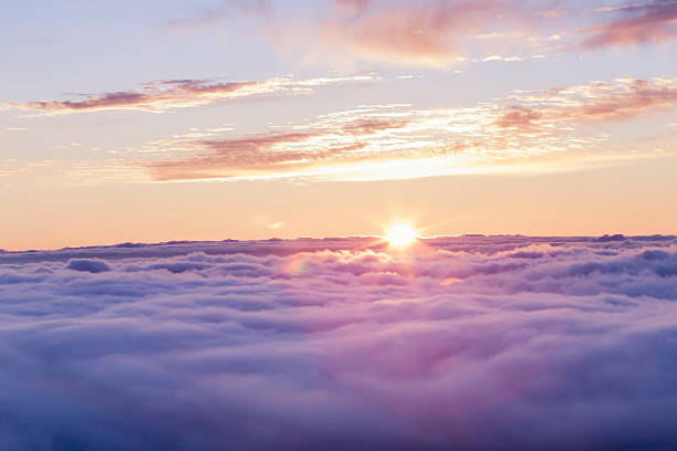 Divine sunset above the clouds Sunset above a soft cloudscape in Tenerife. above cloud stock pictures, royalty-free photos & images