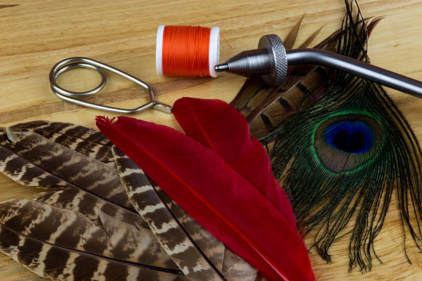 istock Fishing Fly Tying Equipment on Wooden Bench 524381282
