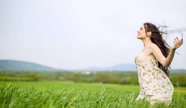 istock woman in tall grass 524381546