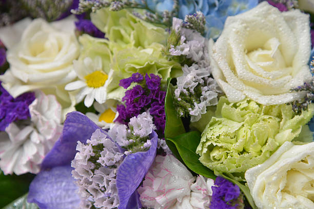istock Bouquet with different kind of flowers in basket isolated 524381914