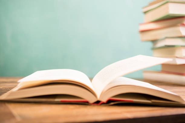 istock Back to school. Education. Textbooks on desk. Chalkboard. 524383716