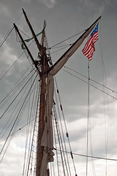 US flag is on a mast of the sailing ship