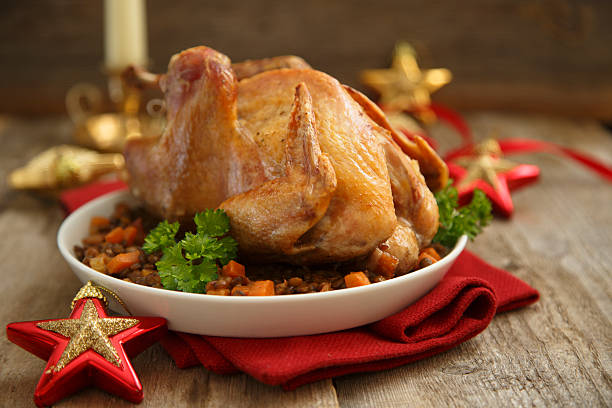 Christmas bird Christmas bird on white plate with bacon and lentils guinea fowl stock pictures, royalty-free photos & images