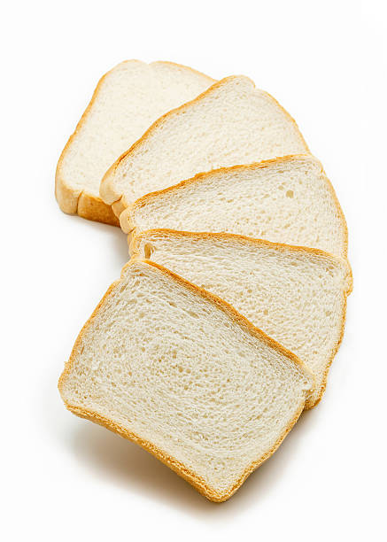 istock Slices of white bread isolated 524389236
