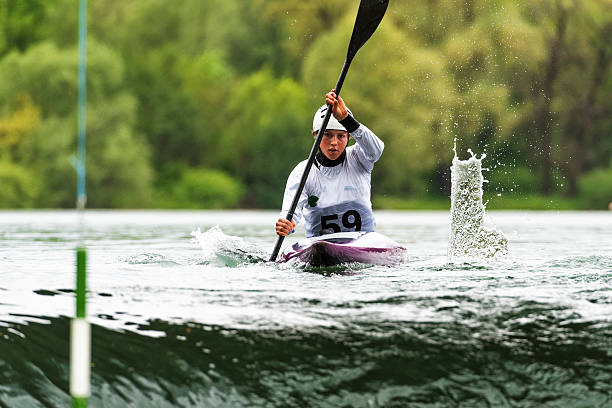 Front view of young female kayaker ready to enter the whitewater