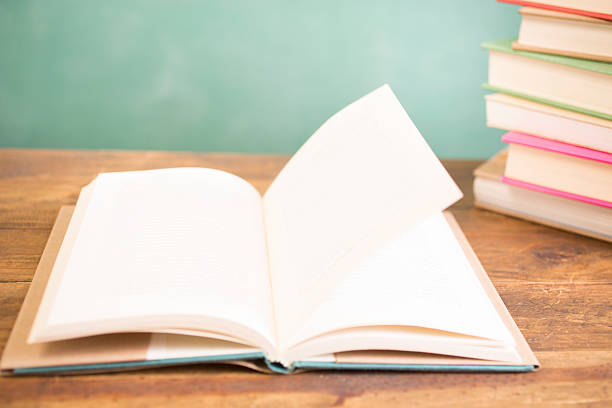 istock Back to school. Education. Textbooks on desk. Chalkboard. 524392136