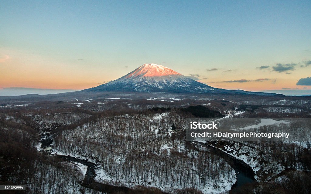 Mt. Yotei, Niseko, Japan Mt. Yotei, Japan, taken on a perfect evening in Niseko with a DJI Phantom 3 drone. The positioning of this majestic volcano is perfect to catch the last of the evening sun and can be viewed from Niseko ski resort. Niseko Stock Photo