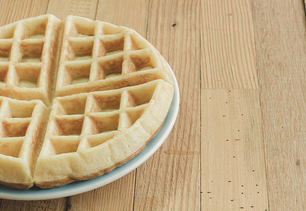 istock Full waffle with blue dish on the wooden background 524394378