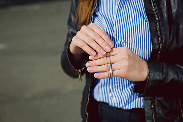 istock business Woman showing beautiful silver necklace. 524394810