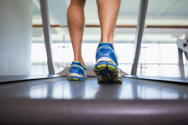 istock Low section of a man running on treadmill 524396133