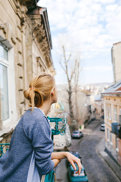 istock Girl on the balcony 524396419