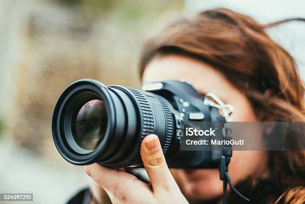 Young Woman Using Dslr Camera Stock Photo - Download Image Now - Photographer, Camera - Photographic Equipment, Photographing