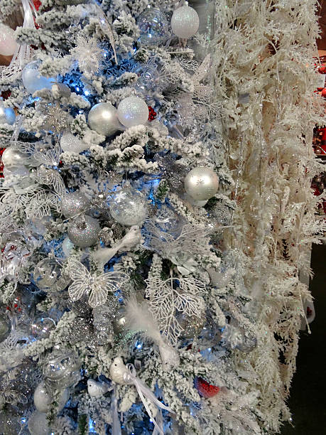 istock Artificial Christmas tree, white / silver decorations, glitter, birds, butterflies, baubles 524397347