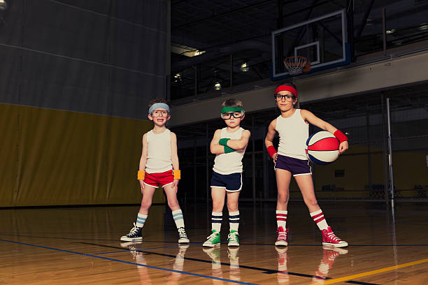 Nerd Basketball Team Retro-styled portrait of young children who are ready to school you in basketball. basketball ball photos stock pictures, royalty-free photos & images
