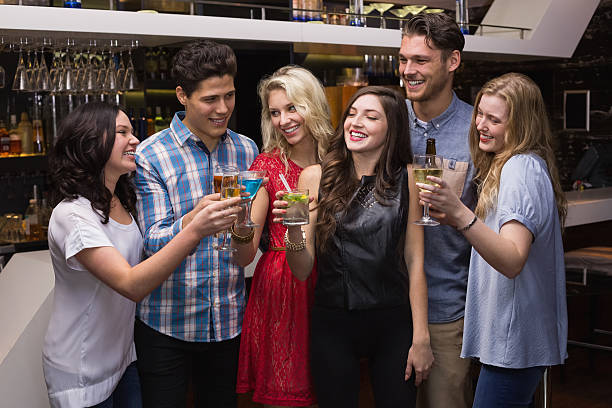 istock Happy friends having a drink together 524397935