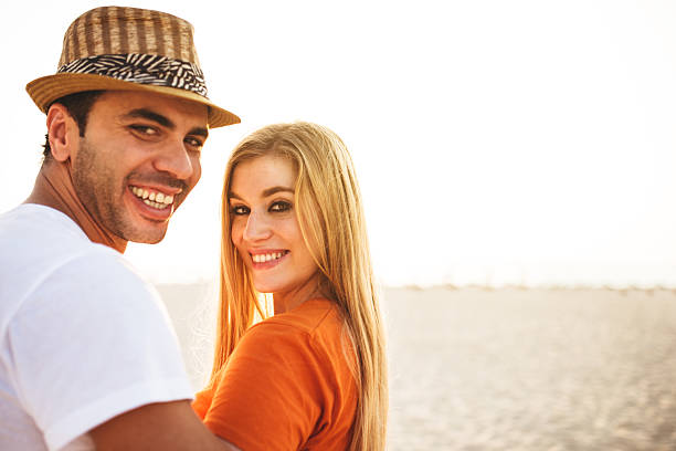istock togetherness couple on the beach 524400461