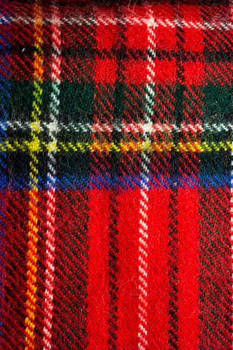 Close-up of a red plaid tartan winter scarf.