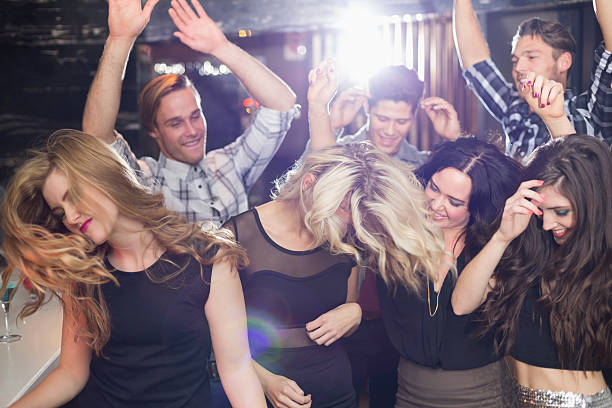 istock Stylish friends dancing and smiling 524402729
