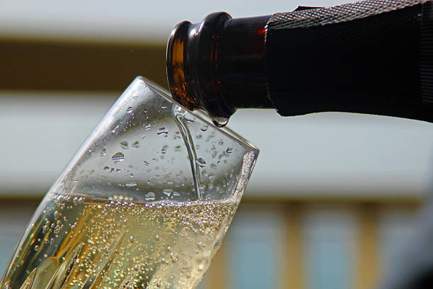 istock Pouring a glass of champagne 524402981