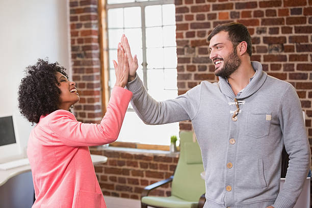 istock Business people high fiving at office 524403827