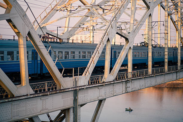 istock train on the railway bridge across Dnepr river 524423127
