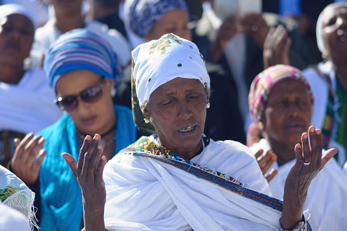 Jerusalem, Israel - November 20, 2014: Ethiopian Jewish women pray at the Sigd, in Jerusalem, Israel. The Sigd is an annual holiday of the Ethiopian Jews