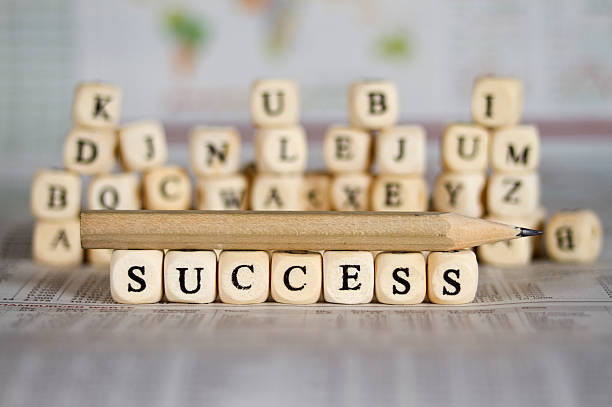 istock success word on newspaper background 524424835