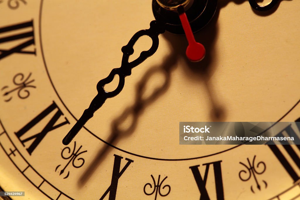 Clock Face ticking Close up of a clock face with ticking arms Accuracy Stock Photo