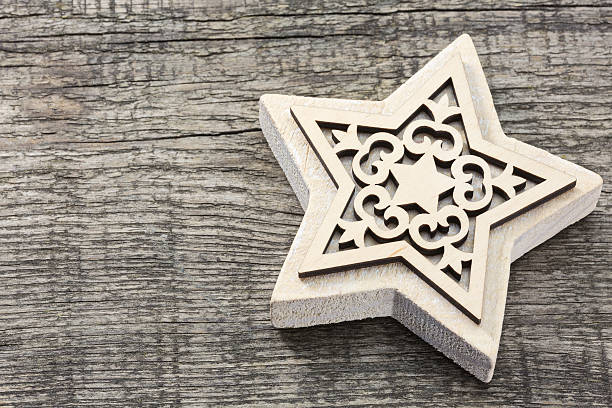 Rustic Christmas ornaments on textured wooden background with copy space