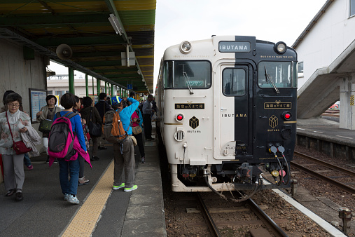 Ibusuki, Japan - October 30, 2014 : People at Ibusuki Station. Ibusuki no Tamatebako is a sightseeing train run between Kagoshima to Ibusuki.