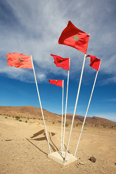 istock National flags of Morocco above blue sky 524426007