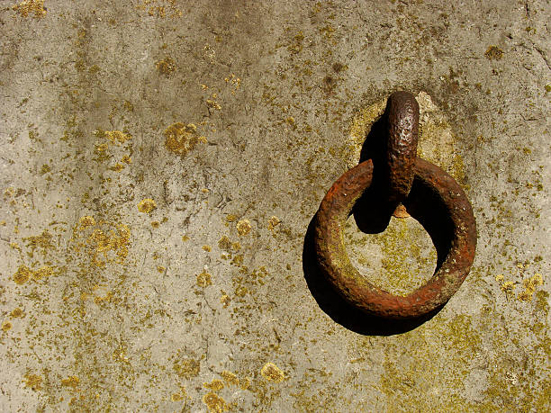 istock rusty ring on a grunge wall background in strong sunlight 524427339