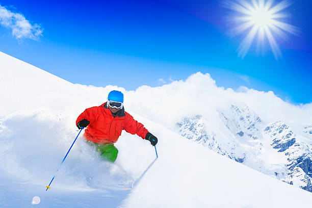 istock Freeride in fresh powder snow - man skiing downhill 524428817